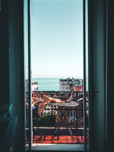 person sitting on balcony