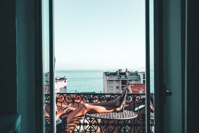 person sitting on balcony