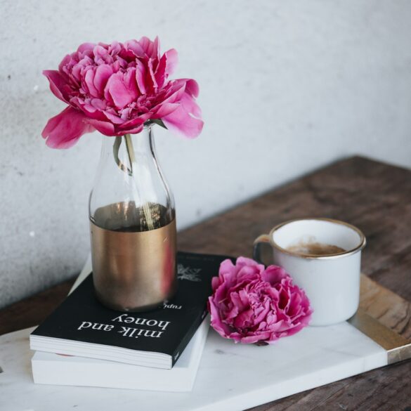 pink petaled flower on bottle