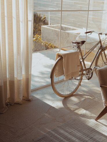 white bike near glass wall